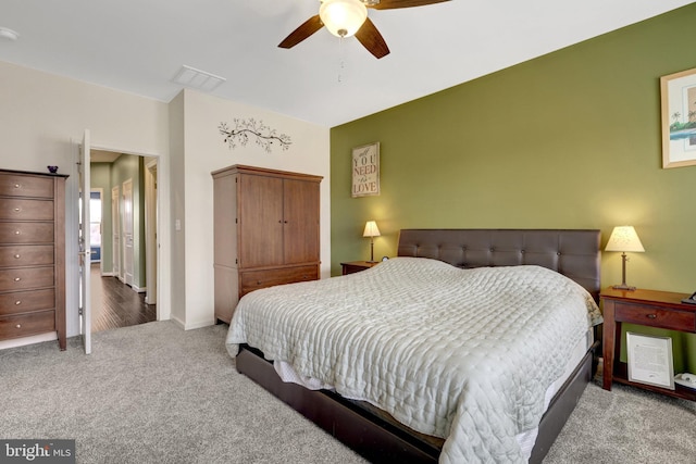 bedroom with carpet, ceiling fan, and baseboards