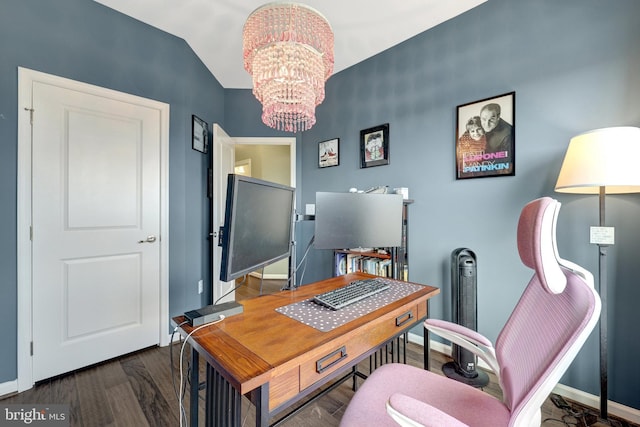 office area with a chandelier, wood finished floors, baseboards, and vaulted ceiling
