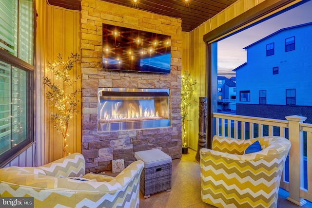 bedroom with an outdoor stone fireplace