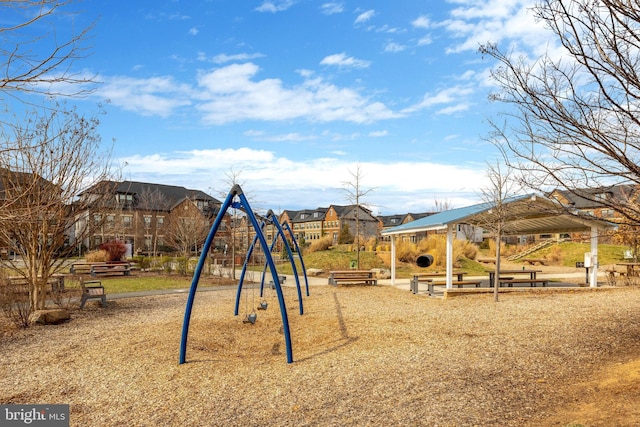 community jungle gym with a residential view