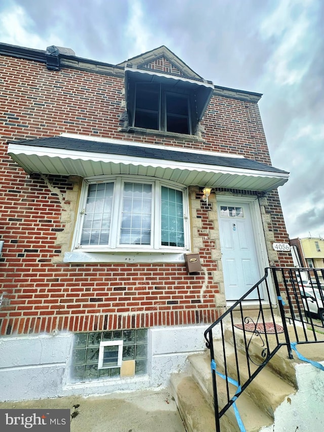 exterior space featuring brick siding