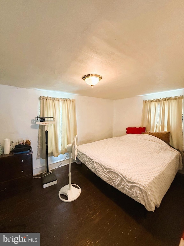 bedroom with wood finished floors