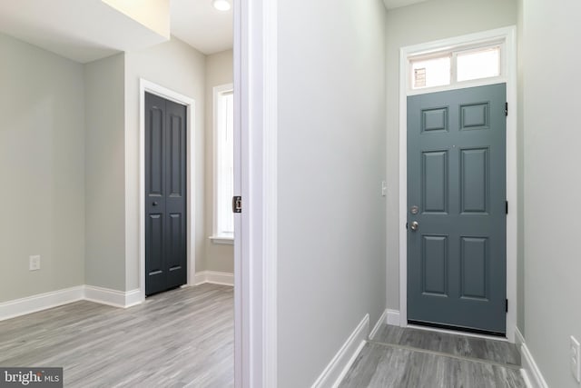 1907 E Lafayette Ave, Baltimore, MD 21213 - foyer entrance featuring wood finished floors, baseboards, and a healthy amount of sunlight
