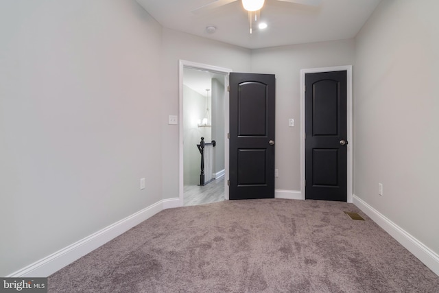 1907 E Lafayette Ave, Baltimore, MD 21213 - unfurnished bedroom with baseboards, visible vents, ceiling fan, and carpet