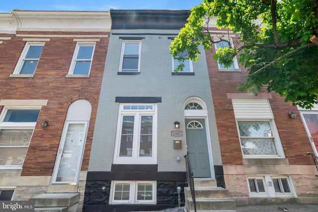 1907 E Lafayette Ave, Baltimore, MD 21213 - townhome / multi-family property featuring entry steps and brick siding