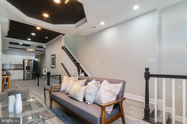 1907 E Lafayette Ave, Baltimore, MD 21213 - living room featuring light wood-style flooring, recessed lighting, baseboards, stairs, and crown molding