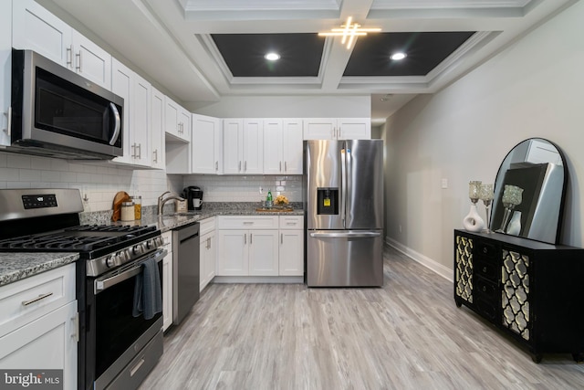 1907 E Lafayette Ave, Baltimore, MD 21213 - kitchen featuring coffered ceiling, light stone counters, stainless steel appliances, and baseboards