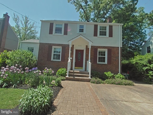 9210 Glenville Rd, Silver Spring, MD 20901 - colonial home featuring brick siding and a chimney