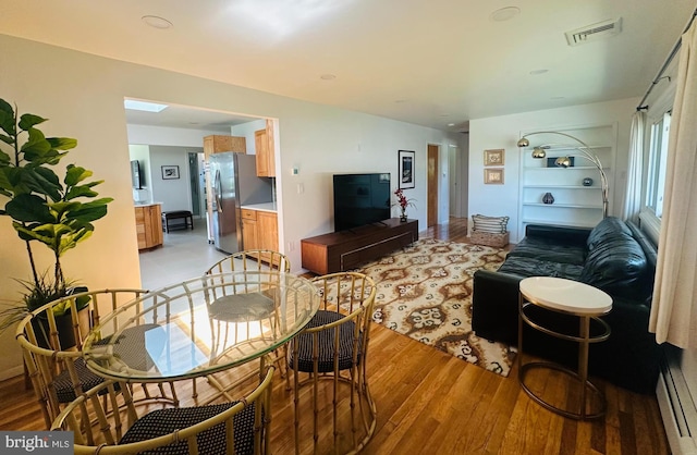 481 Laudermilch Rd, Hershey, PA 17033 - living room featuring a baseboard heating unit and light wood finished floors