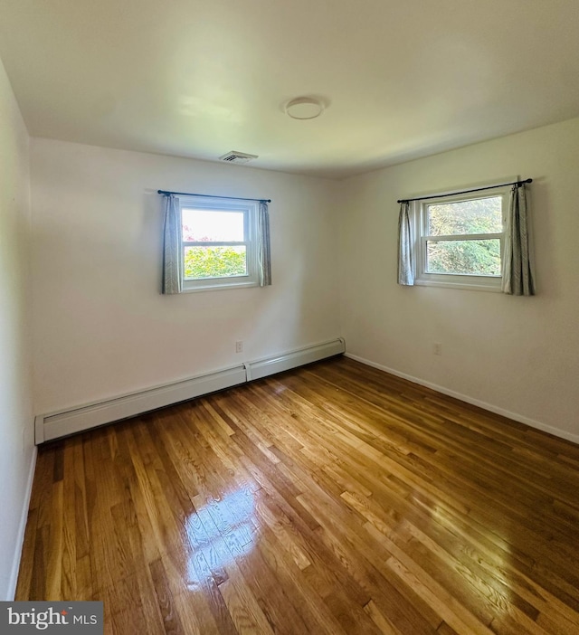 481 Laudermilch Rd, Hershey, PA 17033 - empty room with a baseboard heating unit, wood finished floors, and baseboards
