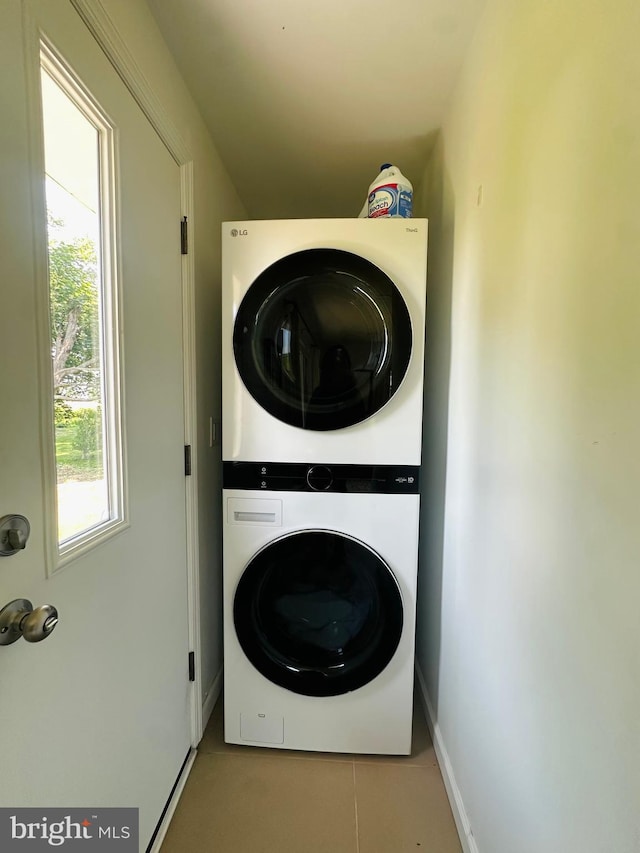 481 Laudermilch Rd, Hershey, PA 17033 - washroom featuring stacked washer and clothes dryer, baseboards, and tile patterned flooring