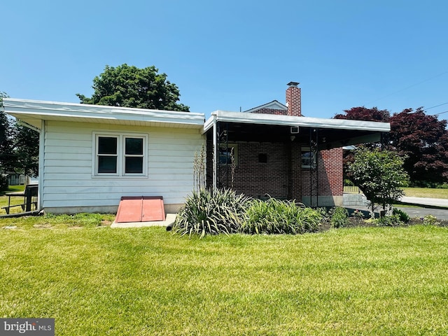 481 Laudermilch Rd, Hershey, PA 17033 - rear view of property featuring a lawn and a chimney