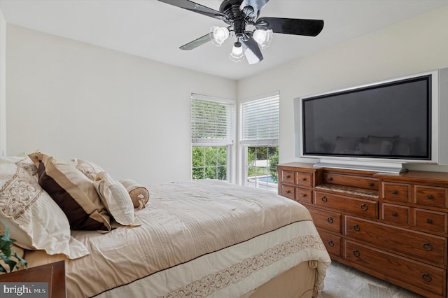 bedroom with light colored carpet and ceiling fan