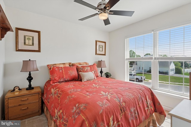 carpeted bedroom with a ceiling fan