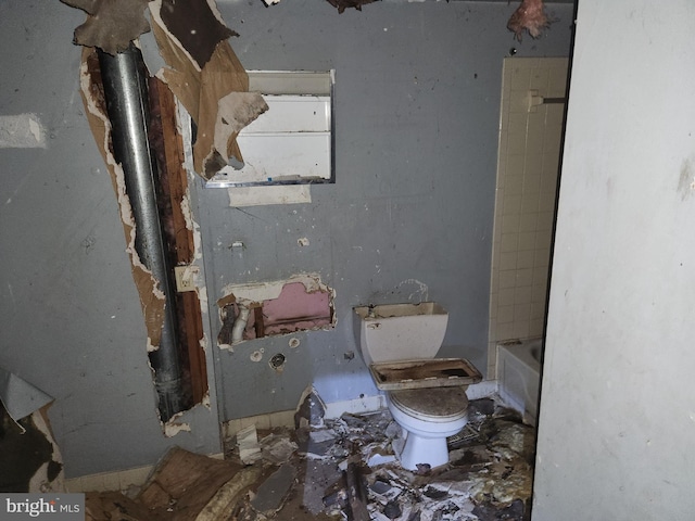bathroom featuring walk in shower, a bath, and toilet