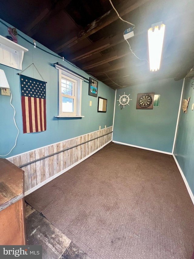 below grade area featuring carpet floors