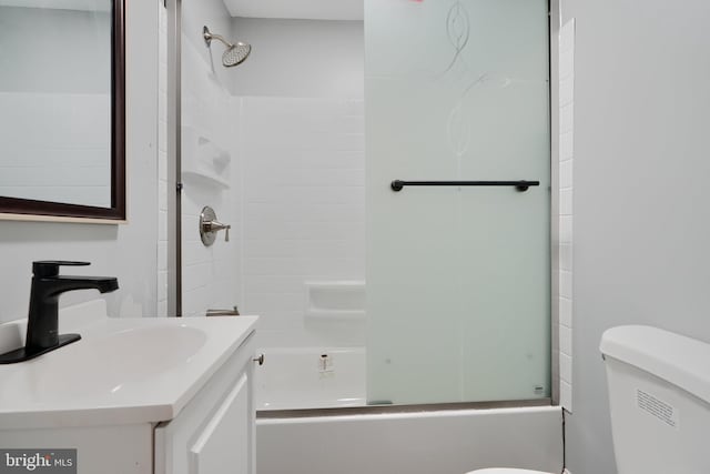 bathroom featuring toilet, bathtub / shower combination, and vanity
