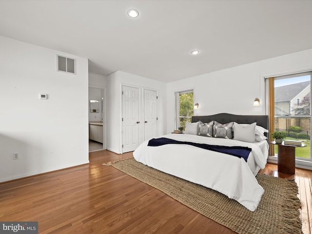 1924 Hidden Point Rd, Annapolis, MD 21409 - bedroom featuring wood finished floors, recessed lighting, and baseboards