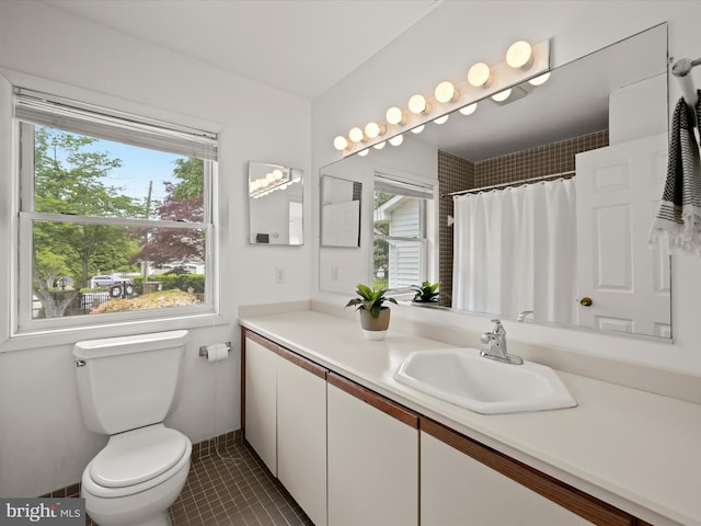 1924 Hidden Point Rd, Annapolis, MD 21409 - full bathroom featuring healthy amount of natural light, tile patterned flooring, vanity, and toilet