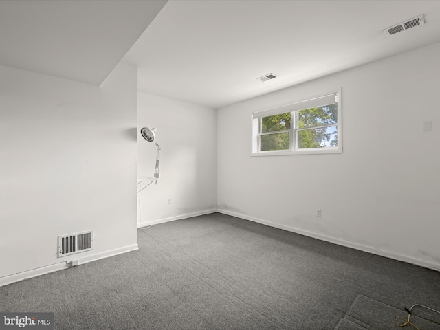 1924 Hidden Point Rd, Annapolis, MD 21409 - unfurnished room with dark colored carpet and baseboards