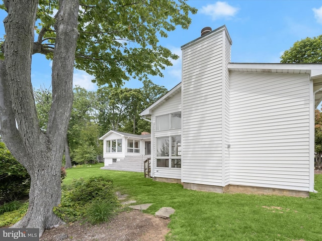 1924 Hidden Point Rd, Annapolis, MD 21409 - back of house featuring a chimney and a lawn