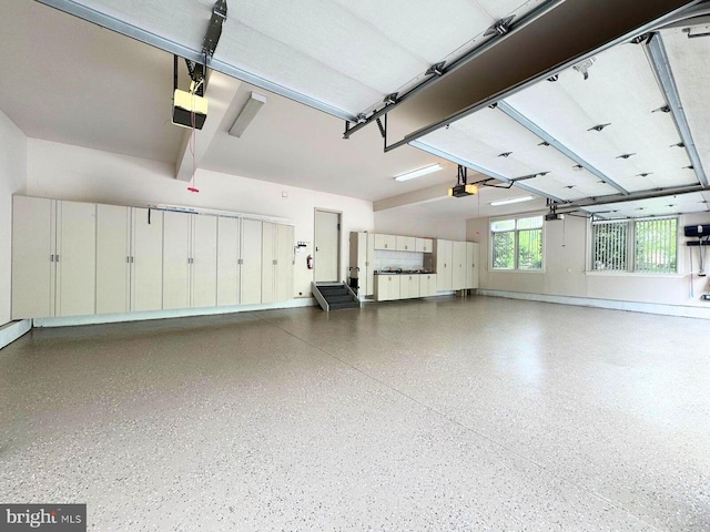 1389 Lamplighter Cir, Gwynedd, PA 19436 - garage featuring a garage door opener and baseboards