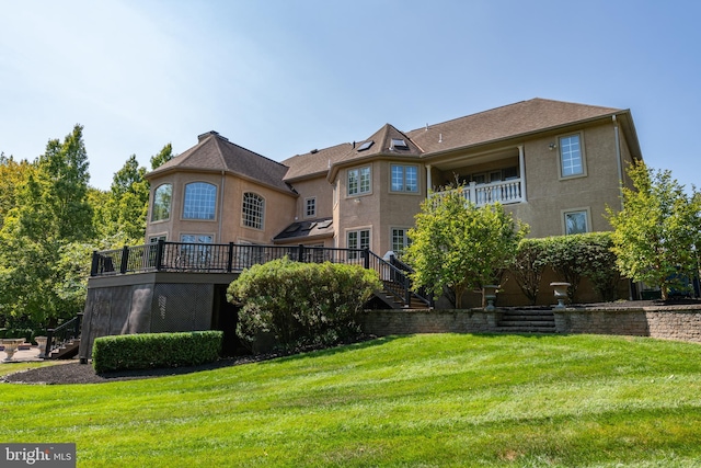 1389 Lamplighter Cir, Gwynedd, PA 19436 - back of house with stairs, a lawn, a deck, and stucco siding