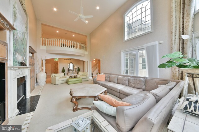 1389 Lamplighter Cir, Gwynedd, PA 19436 - living area featuring high vaulted ceiling, ceiling fan, a fireplace, recessed lighting, and healthy amount of natural light