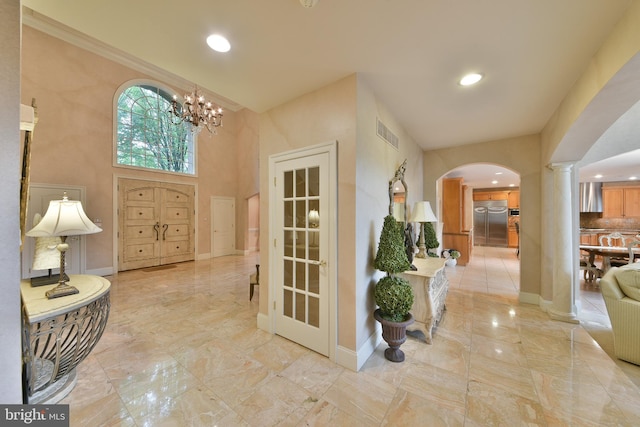 1389 Lamplighter Cir, Gwynedd, PA 19436 - foyer with arched walkways, a chandelier, baseboards, recessed lighting, and ornate columns