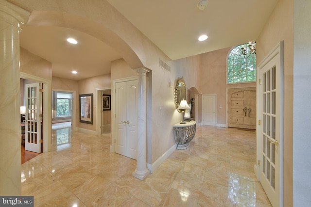 1389 Lamplighter Cir, Gwynedd, PA 19436 - corridor with arched walkways, marble finish flooring, baseboards, decorative columns, and recessed lighting