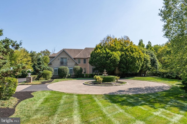 1389 Lamplighter Cir, Gwynedd, PA 19436 - view of front facade featuring curved driveway and a front lawn