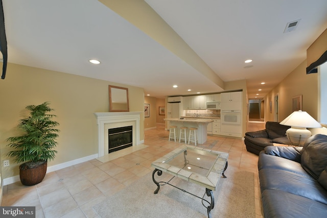 1389 Lamplighter Cir, Gwynedd, PA 19436 - living room with light tile patterned floors, recessed lighting, baseboards, and a fireplace