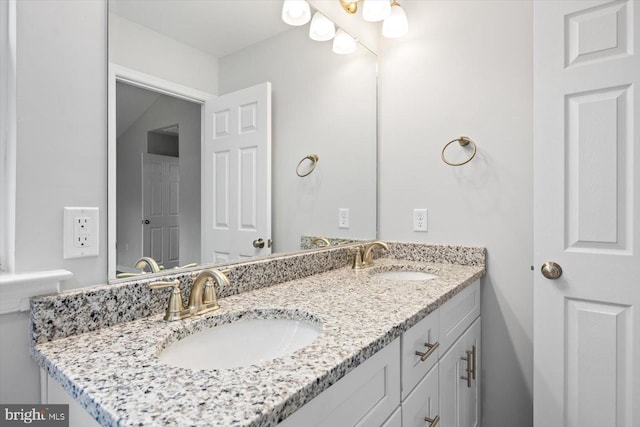 bathroom with a sink and double vanity