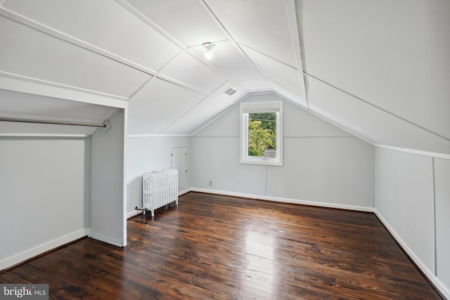 7507 Carroll Ave, Takoma Park, MD 20912 - additional living space with radiator heating unit, lofted ceiling, and wood-type flooring