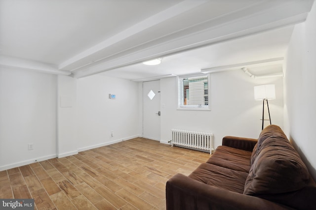 7507 Carroll Ave, Takoma Park, MD 20912 - living room with radiator and light wood finished floors