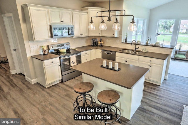 2267 Warrensville Rd Lot 3, Montoursville, PA 17754 - kitchen with dark countertops, stainless steel appliances, a peninsula, and a sink