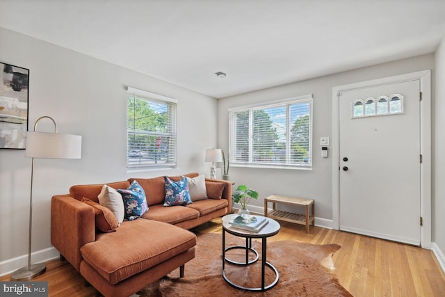 6526 N Capitol St NW, Washington, DC 20012 - living area featuring wood finished floors, plenty of natural light, and baseboards