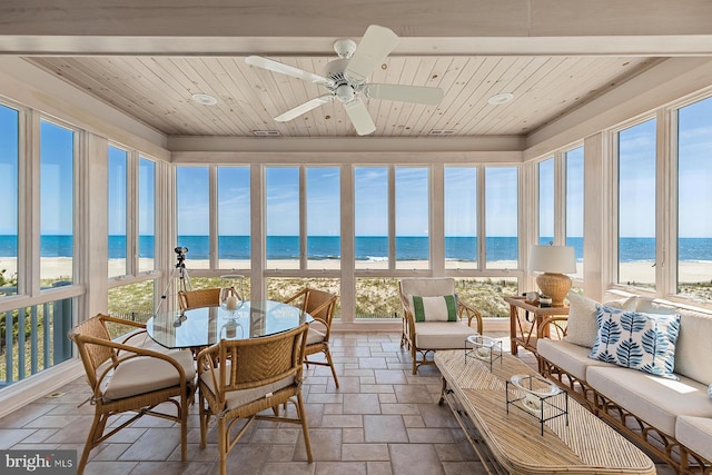 40113 Owens Ct, Fenwick Island, DE 19944 - sunroom / solarium with a beach view, wood ceiling, a water view, and stone tile floors