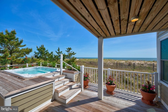40113 Owens Ct, Fenwick Island, DE 19944 - deck featuring a water view and hot tub deck surround