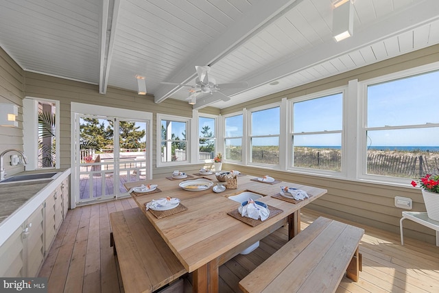 40113 Owens Ct, Fenwick Island, DE 19944 - sunroom with a sink, a wooden deck, beamed ceiling, and hardwood / wood-style floors
