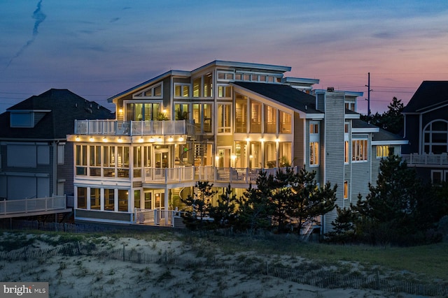 40113 Owens Ct, Fenwick Island, DE 19944 - rear view of property with a balcony and a sunroom