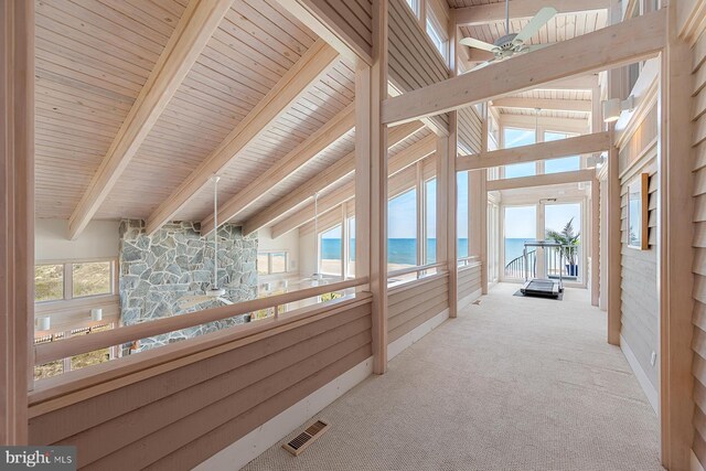 40113 Owens Ct, Fenwick Island, DE 19944 - unfurnished sunroom with beam ceiling, visible vents, ceiling fan, plenty of natural light, and a water view