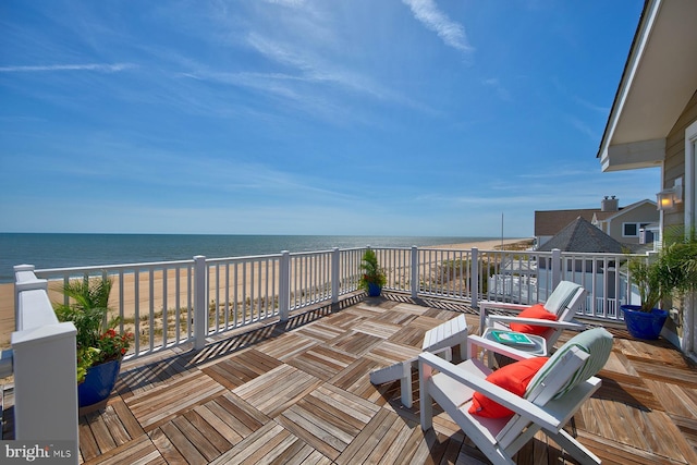 40113 Owens Ct, Fenwick Island, DE 19944 - deck with a water view, outdoor dining area, and a beach view
