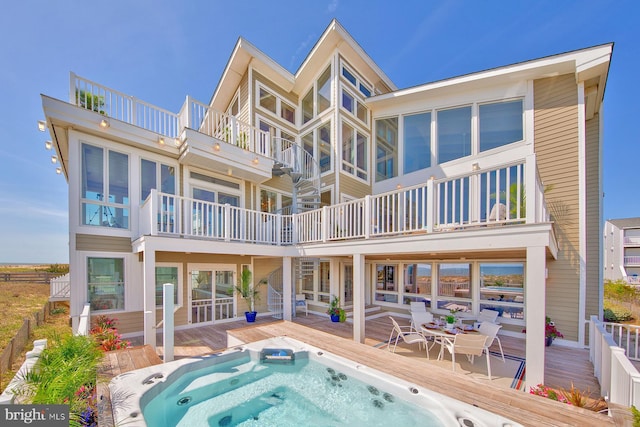 40113 Owens Ct, Fenwick Island, DE 19944 - back of house with a balcony and hot tub deck surround