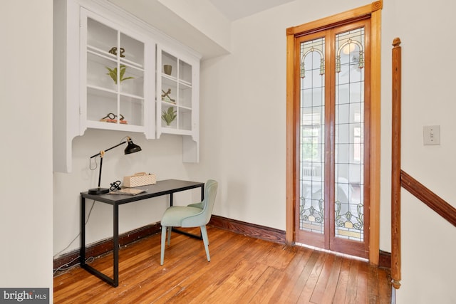 2133 Bolton St, Baltimore, MD 21217 - office area with hardwood / wood-style floors, baseboards, healthy amount of natural light, and french doors