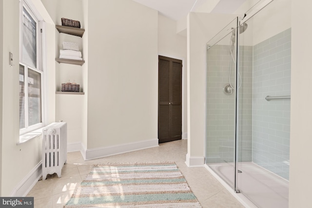 2133 Bolton St, Baltimore, MD 21217 - full bathroom featuring radiator, a stall shower, tile patterned floors, and baseboards