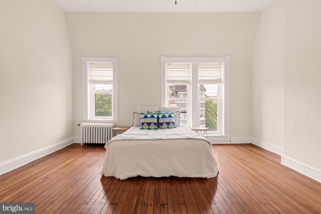 2133 Bolton St, Baltimore, MD 21217 - bedroom featuring radiator heating unit, hardwood / wood-style floors, and baseboards