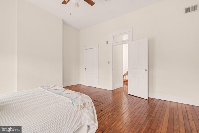 2133 Bolton St, Baltimore, MD 21217 - bedroom with hardwood / wood-style floors, baseboards, and a ceiling fan