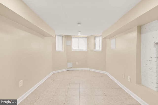 2133 Bolton St, Baltimore, MD 21217 - basement with light tile patterned floors and baseboards