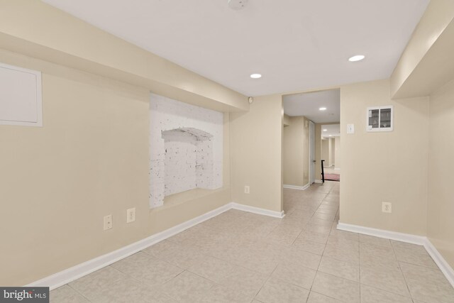 2133 Bolton St, Baltimore, MD 21217 - finished below grade area featuring light tile patterned flooring, recessed lighting, and baseboards